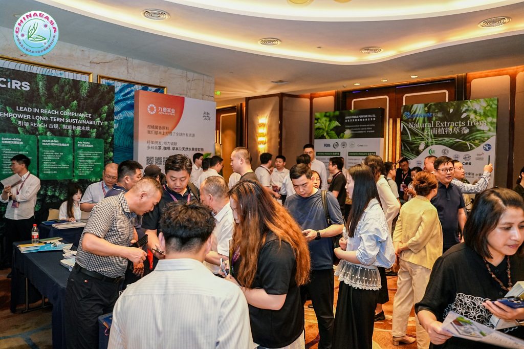 Industry representatives networking at CHINAEASA 2026, discussing natural ingredients, aroma chemicals, essential oils, and flavor and fragrance market trends.